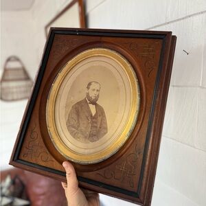 BLACK WALNUT WITH OVAL CENTER DETAILED FRAME CIRCA 1880